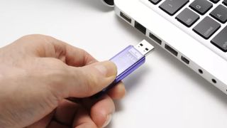 plugging flash drive into laptop